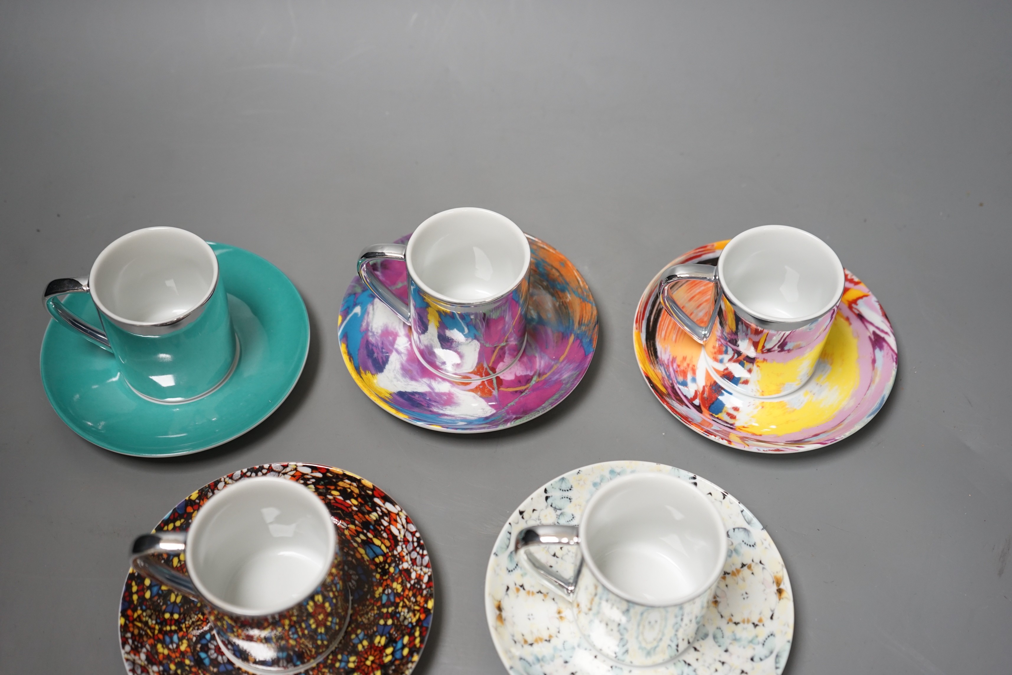 Damian Hirst, a set of six espresso cups and saucers; ‘Doorways to the Kingdom of Heaven’ 2007, ‘For the Love of God’ 2007, ‘The Incomplete Truth’ 2006, ‘Beautiful, cataclysmic pink minty shifting horizon exploding star